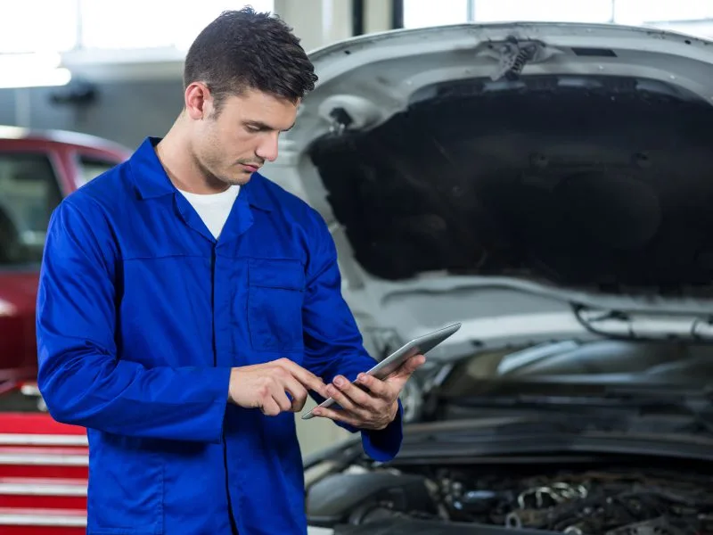 mechanic using digital tablet